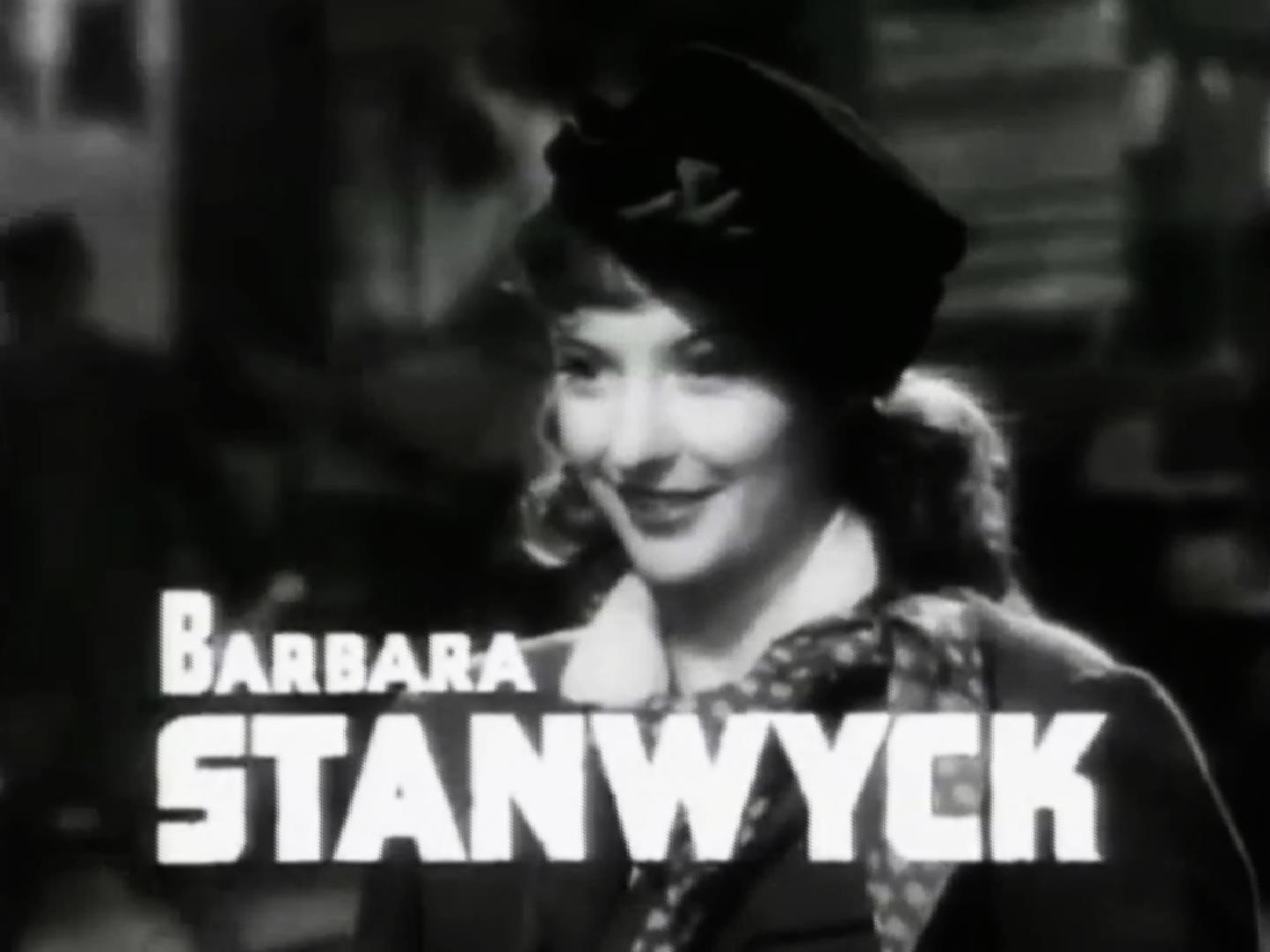 Barbara Stanwyck in a hat and period costume beside a large Barbara Stanwyck cast title in the Union Pacific trailer.