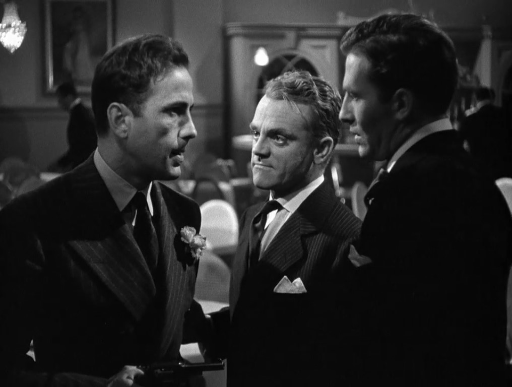 Humphrey Bogart holds a gun beside James Cagney and Jeffrey Lynn in The Roaring Twenties.