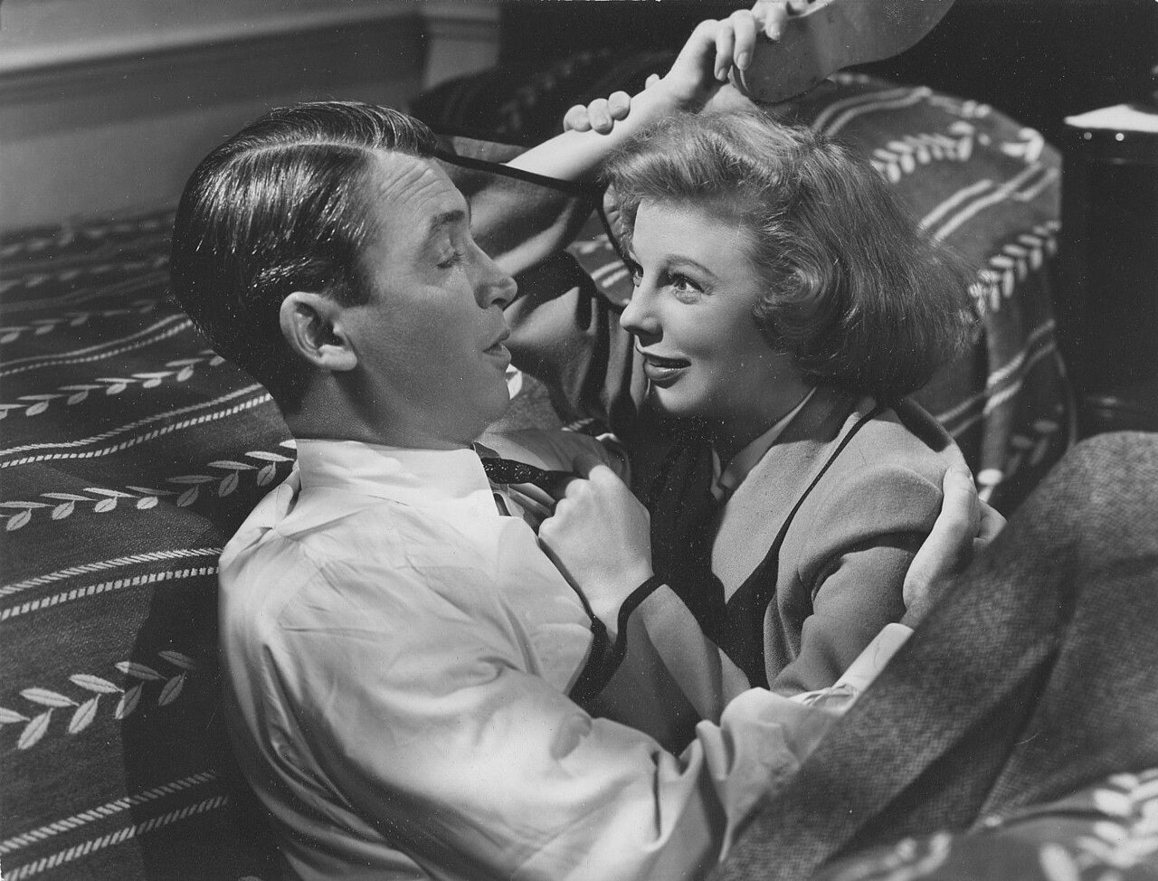 James Stewart reclines beside June Allyson in a black-and-white publicity still from The Stratton Story.