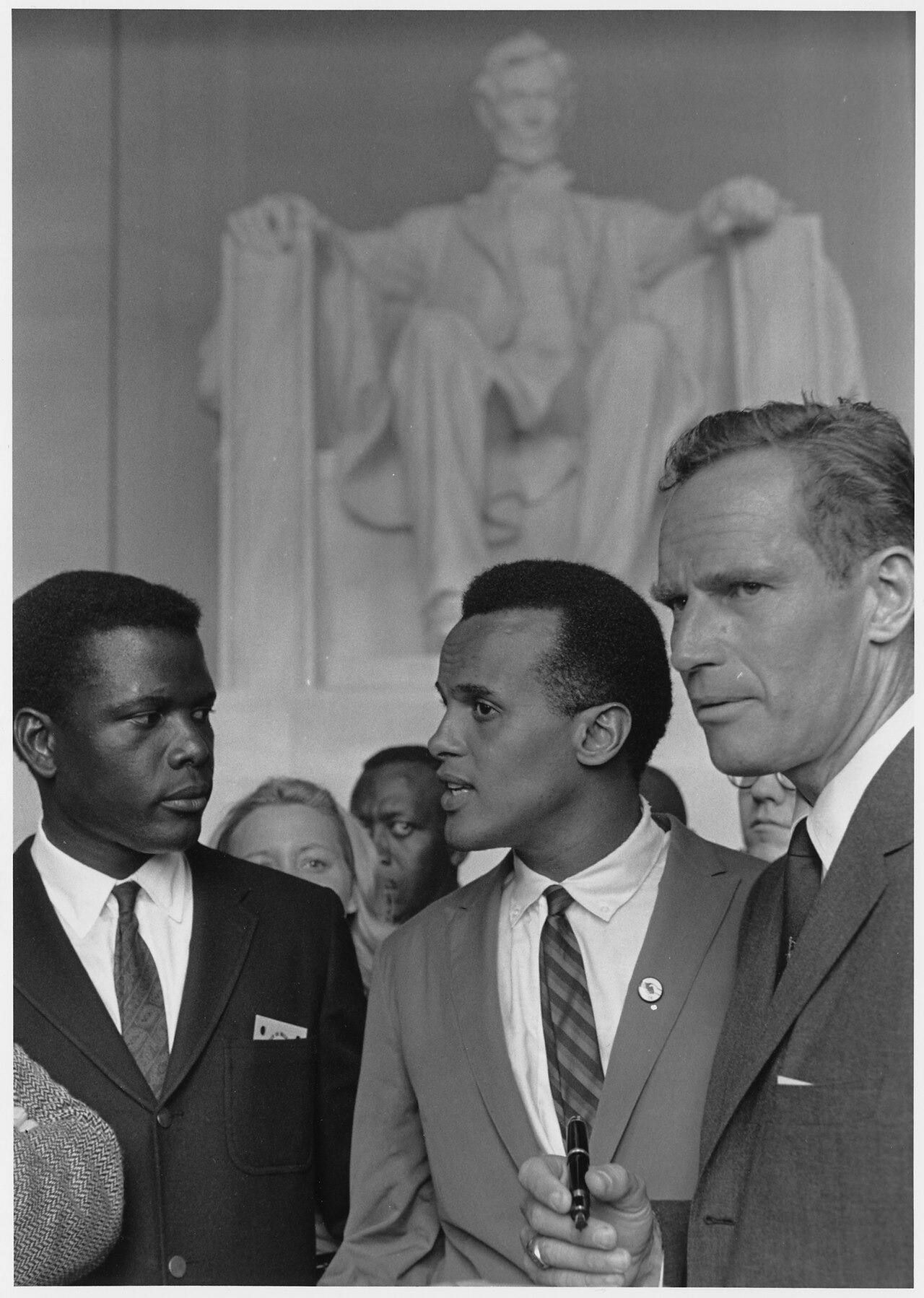 Sidney Poitier stands with Harry Belafonte and Charlton Heston near the Lincoln Memorial during the 1963 March on Washington.