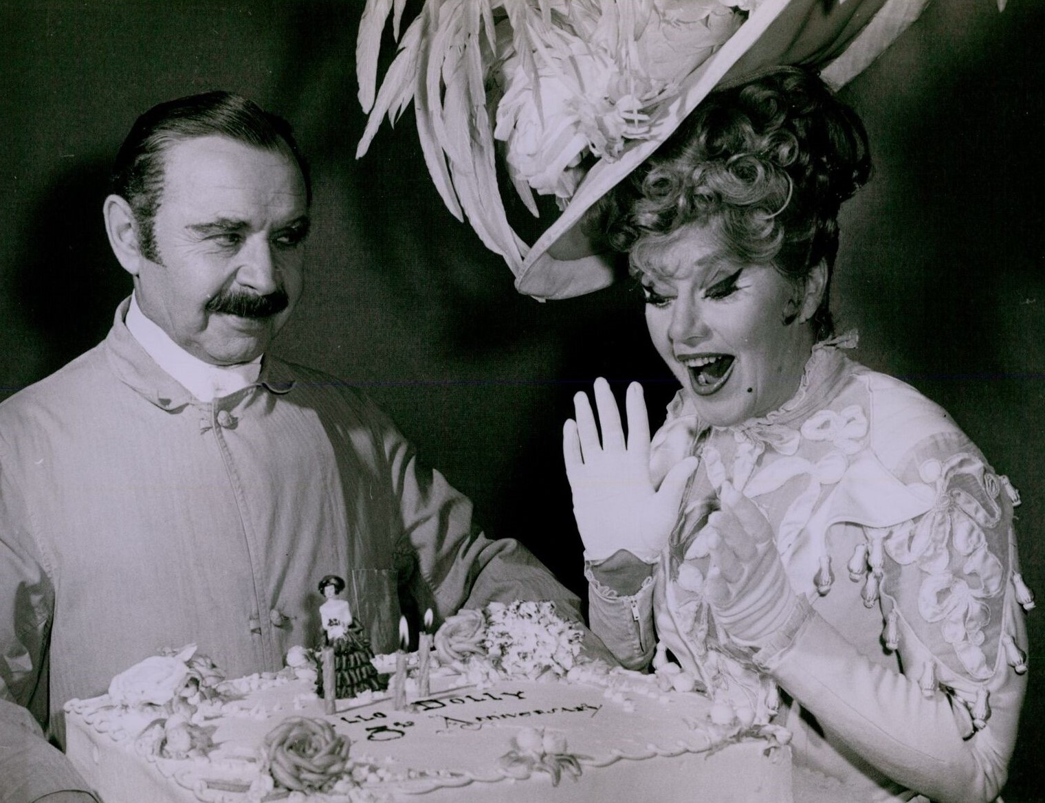 Ginger Rogers and David Burns celebrate the third anniversary of the Broadway production of Hello, Dolly!