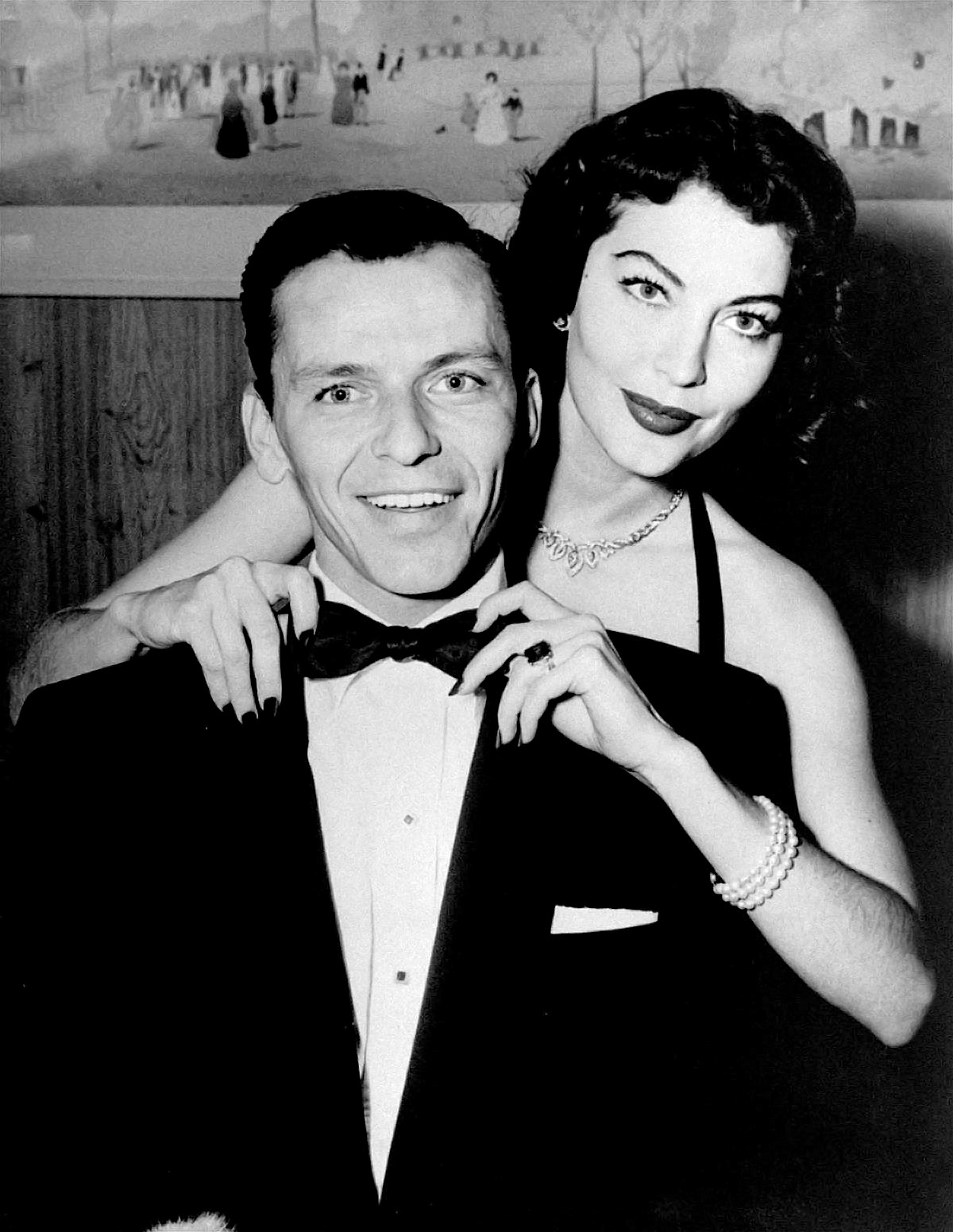 Black-and-white press photograph of Frank Sinatra and Ava Gardner standing together in London in 1951.