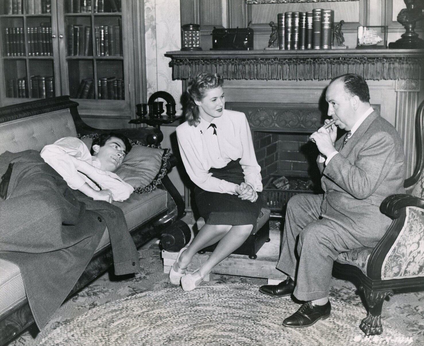 Gregory Peck and Ingrid Bergman stand beside director Alfred Hitchcock during production of Spellbound.