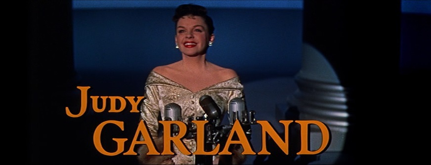 Judy Garland performing in a color trailer image from A Star Is Born.