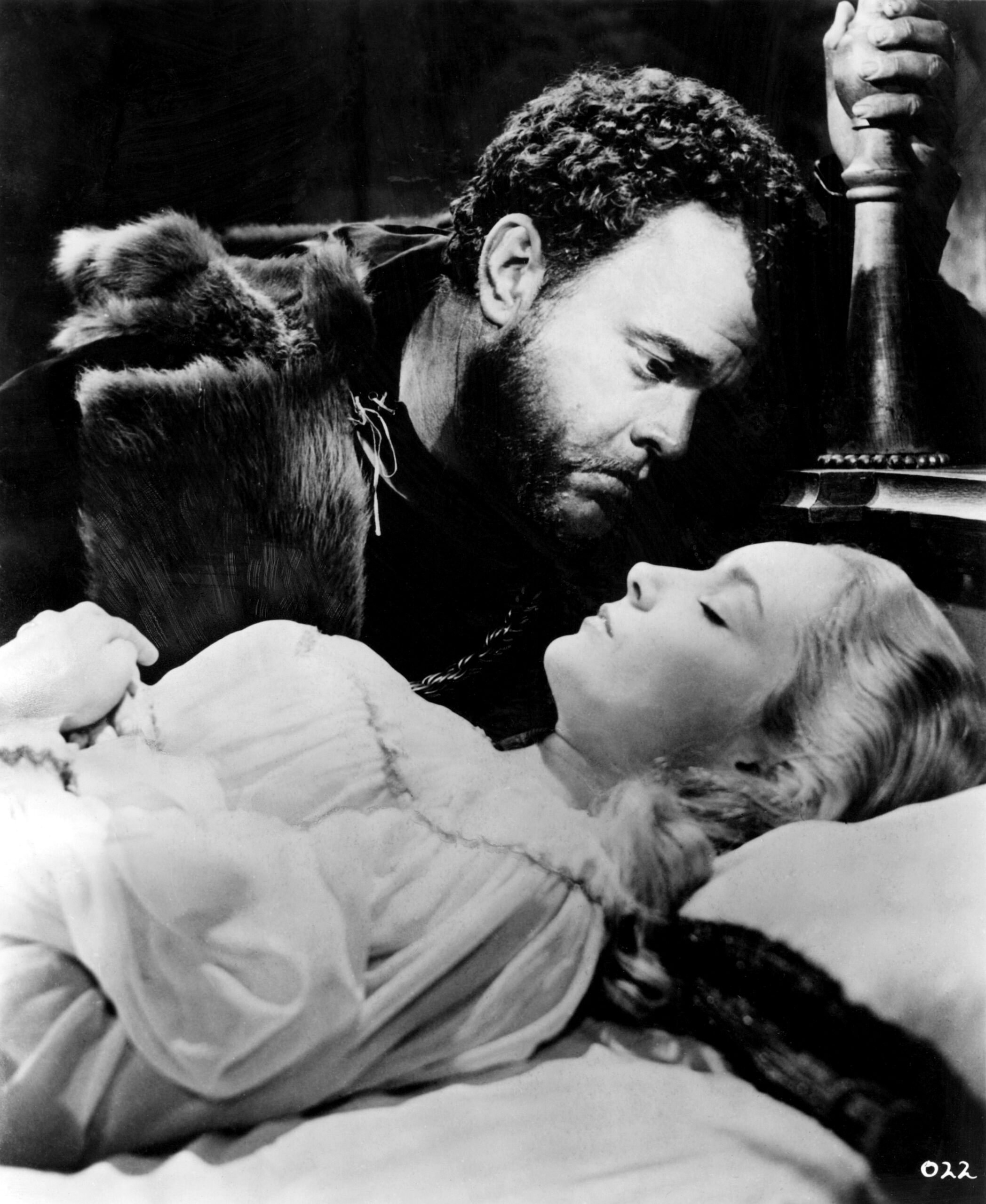 Orson Welles as Othello leaning over Suzanne Cloutier as Desdemona in the 1952 film.
