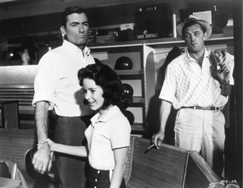 Black-and-white publicity photograph of Gregory Peck, Lori Martin and Robert Mitchum for Cape Fear.