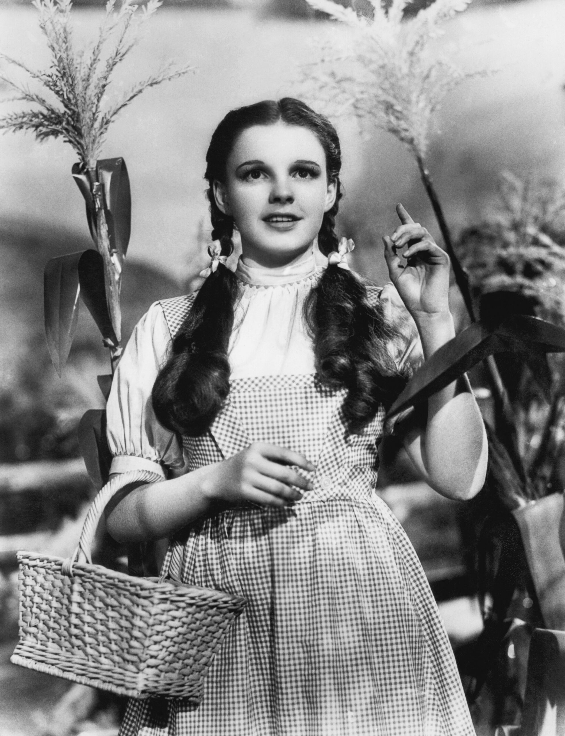 Judy Garland as Dorothy Gale wearing a gingham dress in The Wizard of Oz.