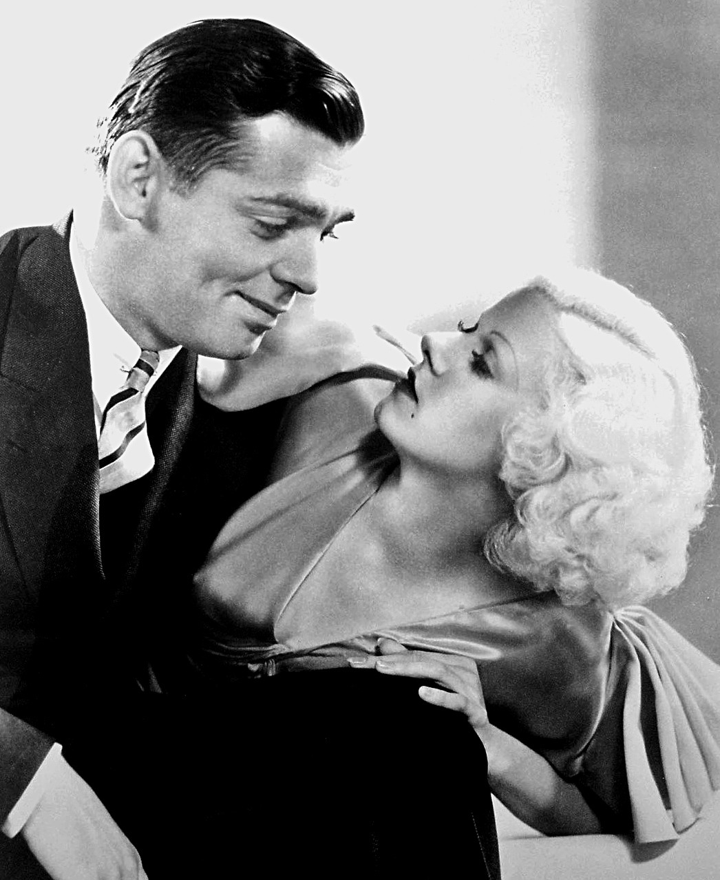 Black-and-white publicity portrait of Clark Gable holding Jean Harlow in Hold Your Man.