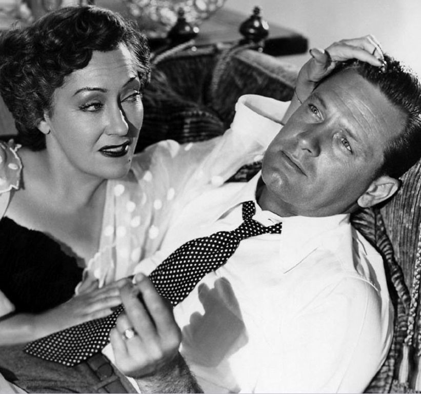 Black-and-white publicity portrait of Gloria Swanson and William Holden for Sunset Boulevard.